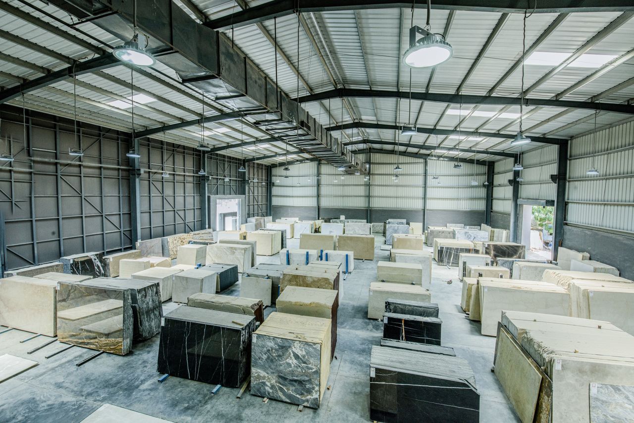 The Art of Drawing Readers In: Your attractive post title goes here Expansive warehouse filled with large stone slabs for industrial use.
